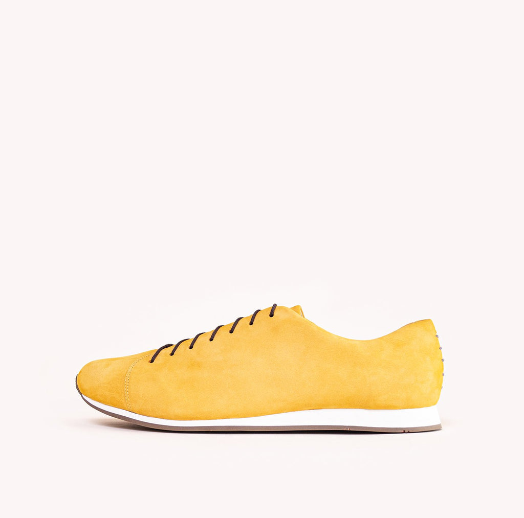 Atheist shoes - side view of Das Sneaker Honey Ochre. Ridiculously comfortable leather sneakers, designed in Berlin and handmade in Portugal